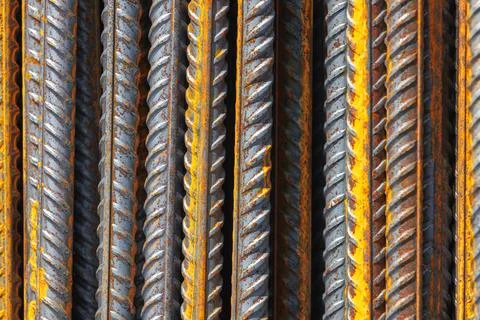 Construction iron rods with rust spots, abstract industrial background Stock Photos