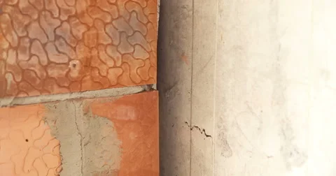 Construction. The joint between the brick wall and concrete wall. Close up. Video stock 53857656