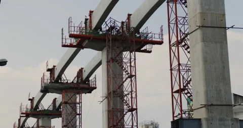 Construction of large concrete cement poles of sky train track in city. Stock Footage 168569301