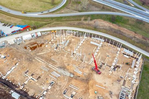 Construction of a large logistics warehouse, top view of the construction sit Stock Photos