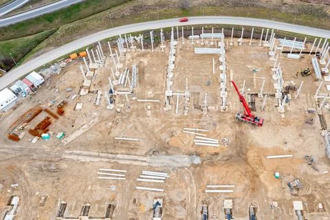 Construction of a large logistics warehouse, top view of the construction sit Stock Photos