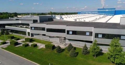 Construction of a large modern factory in its final stages, from above. The Stock Footage 321056024
