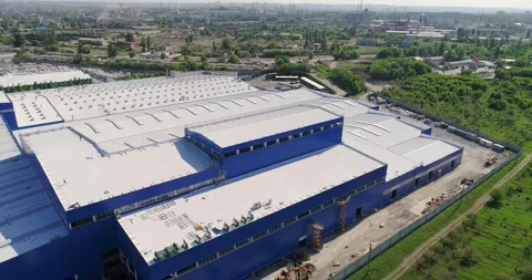 Construction of a large modern factory in its final stages, from above. The Stock Footage 321056643
