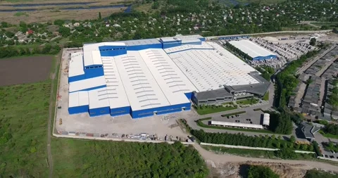 Construction of a large modern factory in its final stages, from above. The Stock Footage 321464941