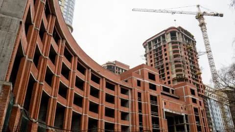 The construction of a large round brick building. Stock Photos