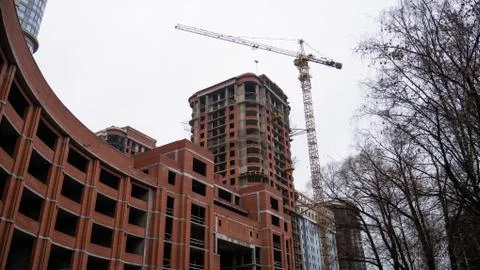 The construction of a large round brick building. Stock Photos