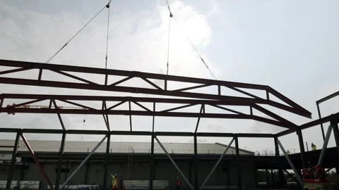 Construction Large Steel Beam Getting Installed To Structure 4K 48FPS SLO-MO Stock Footage 265802431