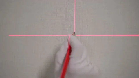 Construction laser level. Builder worker makes repairs in the apartment. 動画素材 235389633