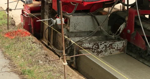 Construction laying curb and gutter concrete DCI 4K Stock Footage 66332098