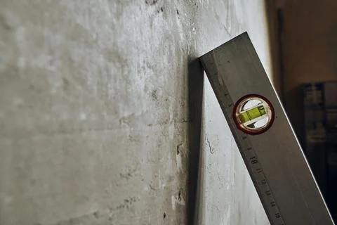 Construction level, a device for measuring the evenness of different objects. Stock Photos