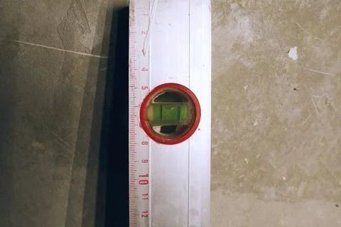Construction level, a device for measuring the evenness of different objects. Stock Photos