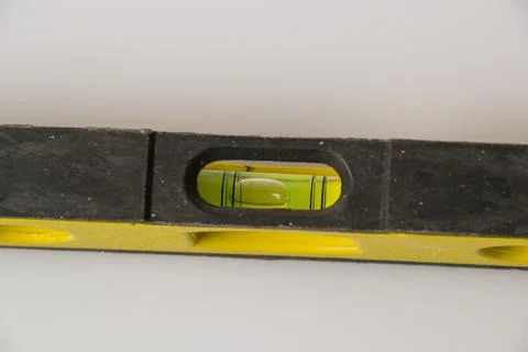 Construction level on a white background, isolate, closeup. Concept repair of Foto stock