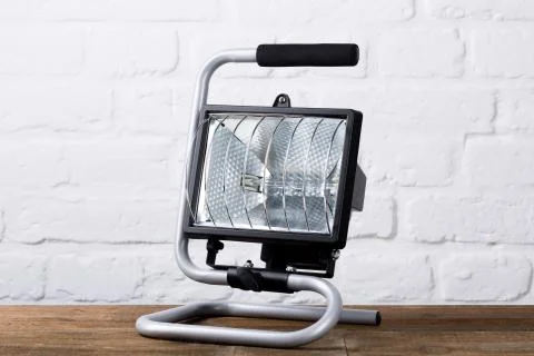 Construction light in front of brick wall Stock Photos