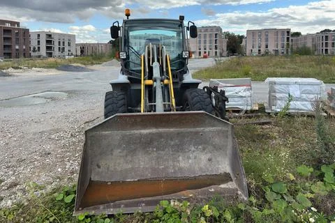 Construction loader at a building site in progress Stock Photos
