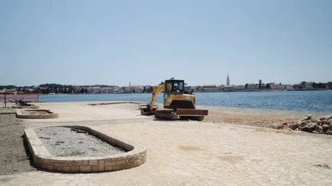 Construction machine on the beach, wide angle static shot. Stock Footage 132301458