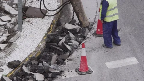 Construction Machine breaking asphalt of the road Video stock 139978209