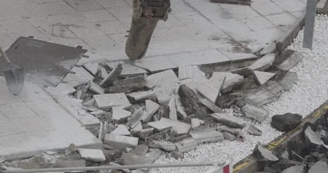 Construction Machine breaking paving stone of a sidewalk Video stock 141149014