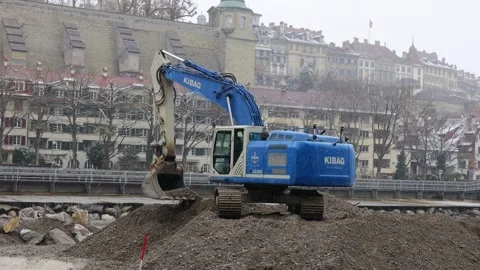 Construction machine digging and transporting, earthmoving activity Stock Footage 321709091