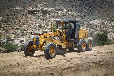 Construction machine motor grader during road Stock Photos