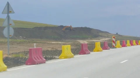 Construction machinery along the road that is being built Stock-Footage 123582695