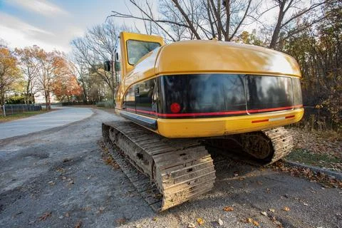 Construction machinery backhoe tractor at construction site Stock Photos