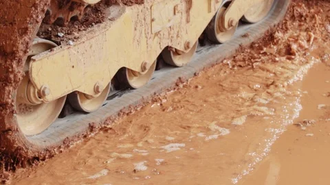 Construction Machinery Drives Through Mud And Dirt Stock Footage 87482225