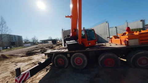 Construction machinery executing precise movements at urban building site Video stock 306397468