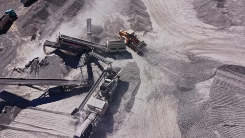 Construction machinery at a gravel mining site during the day Stock Footage 344538520