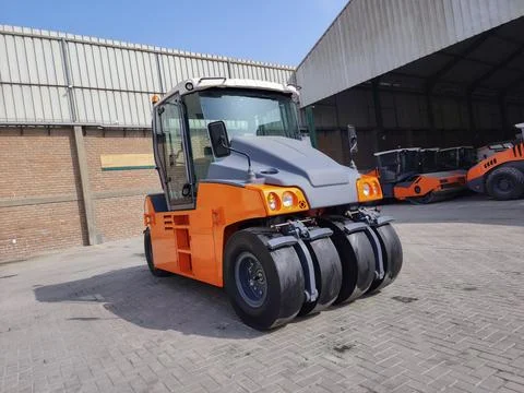 Construction machinery such as pneumatic rollers on display and ready to go.. Stock Photos