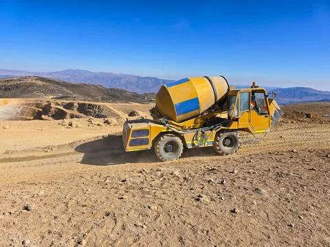 Construction machinery such as a self-loading concrete mixer preparing for .. Stock Photos