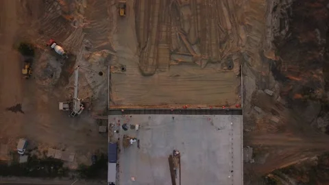 Construction machinery at work levels the surface with sand at the construction Vídeos de archivo 205302383