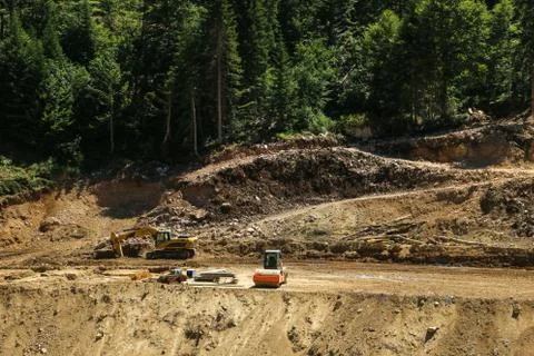 Construction machines in the forest. Forest road construction Stock Photos