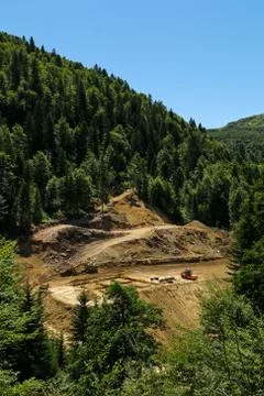 Construction machines in the forest. Forest road construction Stock Photos