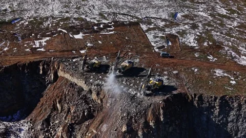 Construction machines work on rocky terrain in remote location Vídeos de archivo 337940323