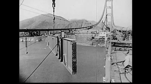 The construction of the main span of the Golden Gate bridge continues on through Video stock 143857025