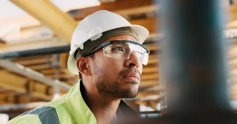 Construction, man and thinking with goggles on site for building progress Stock Photos