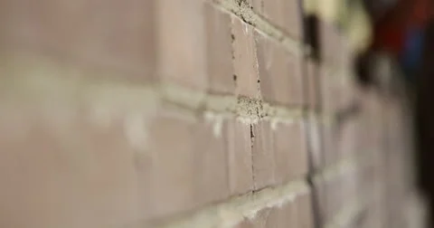 Construction. Man lays bricks. Focus pull. Video stock 53857412