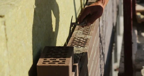 Construction. Man lays bricks. Stock Footage 53857406
