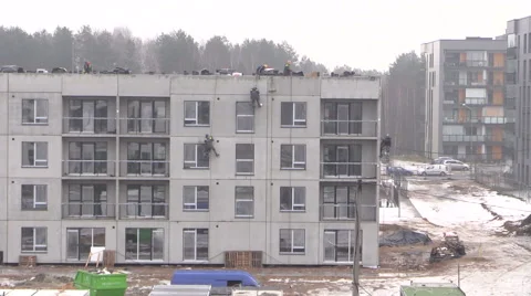 Construction man make repair on new house facade Stock Footage 52883342