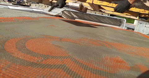 Construction. Man plasters construction netting. Close up. Video stock 53857592
