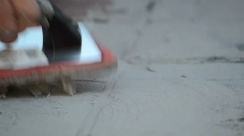 Construction man working cementing with an orange tool 2 Stock-Footage 36672587
