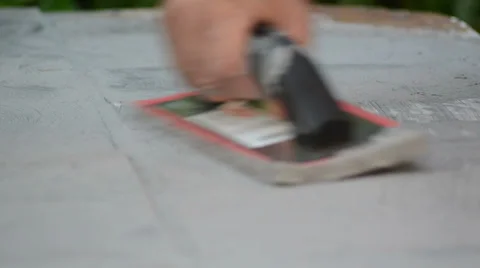 Construction man working cementing with an orange tool 3 스톡 동영상 36672830