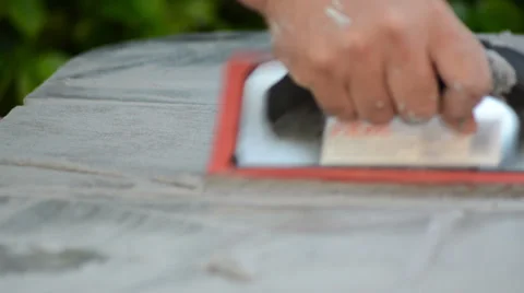 Construction man working cementing with an orange tool 스톡 동영상 36672948