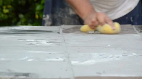 Construction man working cleaning with a yellow sponge 2 Video stock 36673358