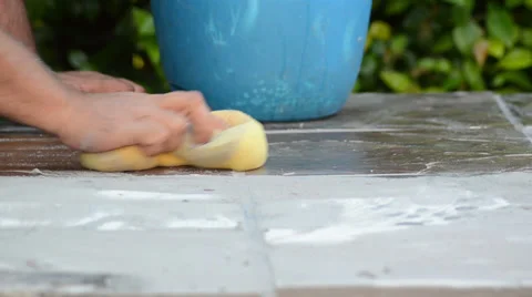 Construction man working cleaning with a yellow sponge and blue bucket 3 Stock Footage 36673706