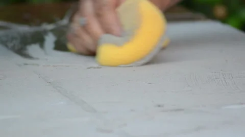 Construction man working cleaning with a yellow sponge 스톡 동영상 36675951