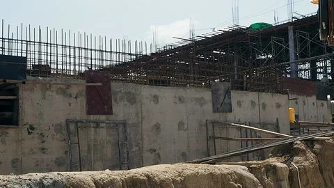 Construction manager and engineer checking plans on construction site. Stock Footage 136471419