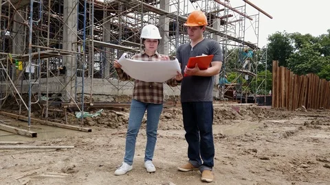 Construction manager and engineer discussing on construction site. Stock Footage 117843606