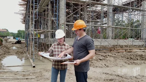 Construction manager and engineer discussing on construction site. Stock Footage 125326550