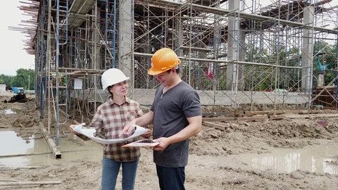 Construction manager and engineer discussing on construction site. Stock Footage 125948672